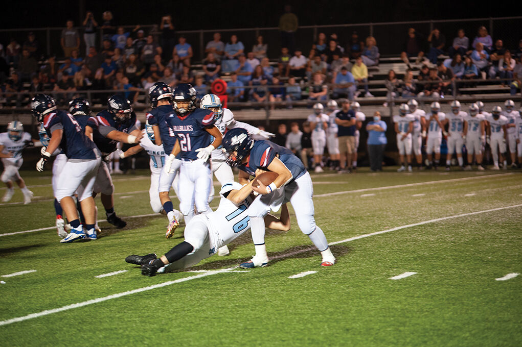 9-23 Mingo Evan Breeding making a tackle.jpg